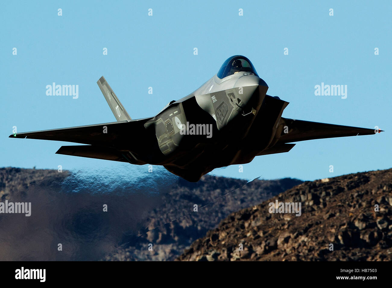 Lockheed Martin F-35A Lighting II from the 323 Squadron, Royal Netherlands Air Force, flies low level through the Jedi Transition, Star Wars Canyon, Death Valley National Park, California, United States of America Stock Photo