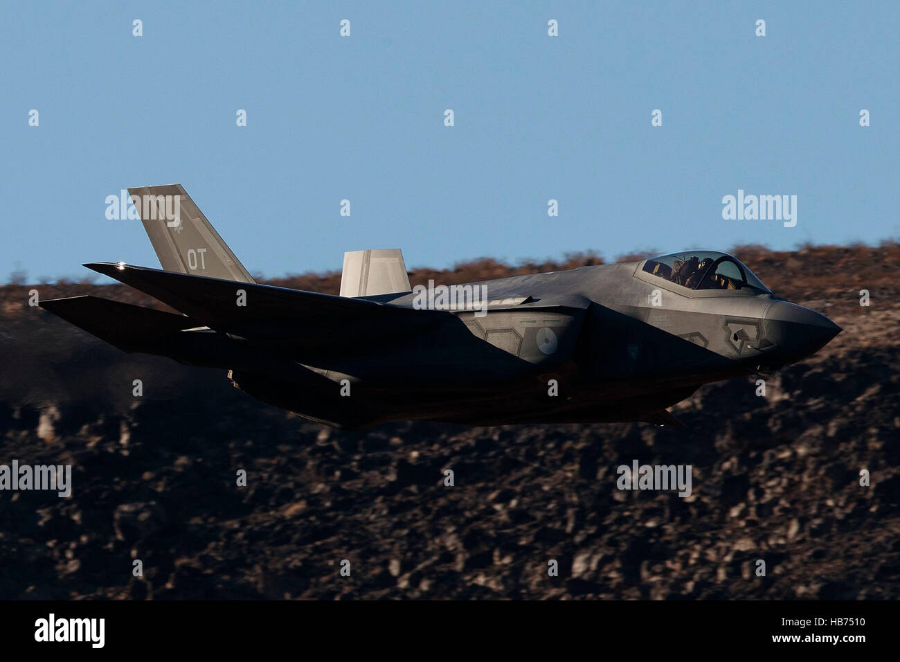 Lockheed Martin F-35A Lighting II from the 323 Squadron, Royal Netherlands Air Force, flies low level through the Jedi Transition, Star Wars Canyon, Death Valley National Park, California, United States of America Stock Photo
