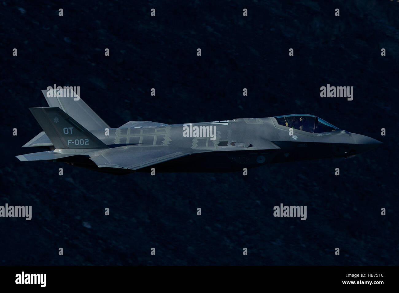 Lockheed Martin F-35A Lighting II from the 323 Squadron, Royal Netherlands Air Force, flies low level through the Jedi Transition, Star Wars Canyon, Death Valley National Park, California, United States of America Stock Photo