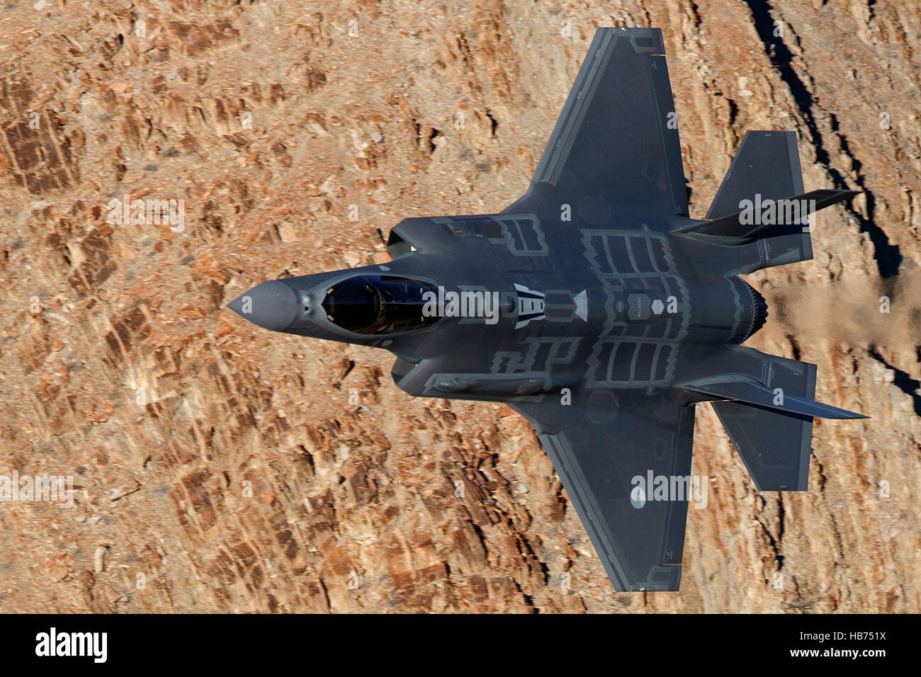 Lockheed Martin F-35A Lighting II from the 323 Squadron, Royal Netherlands Air Force, flies low level through the Jedi Transition, Star Wars Canyon, Death Valley National Park, California, United States of America Stock Photo