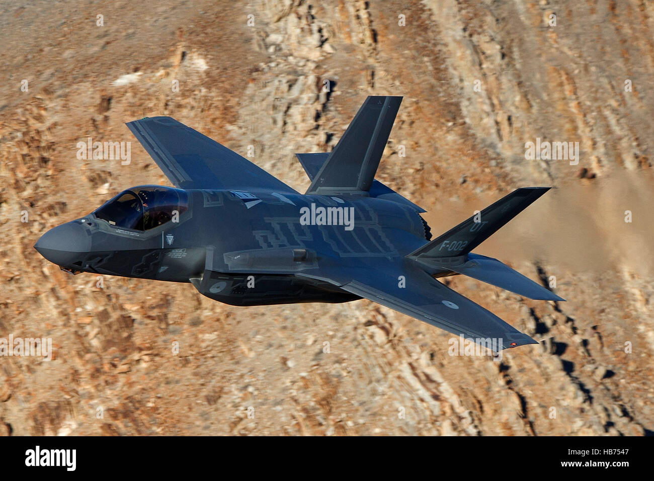 Lockheed Martin F-35A Lighting II from the 323 Squadron, Royal Netherlands Air Force, flies low level through the Jedi Transition, Star Wars Canyon, Death Valley National Park, California, United States of America Stock Photo