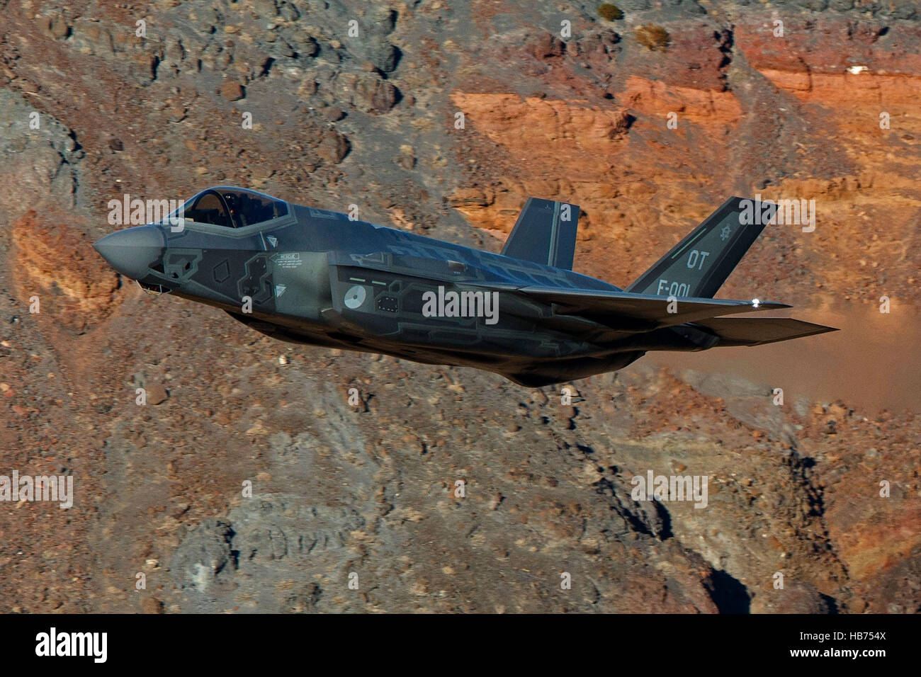 Lockheed Martin F-35A Lighting II from the 323 Squadron, Royal Netherlands Air Force, flies low level through the Jedi Transition, Star Wars Canyon, Death Valley National Park, California, United States of America Stock Photo