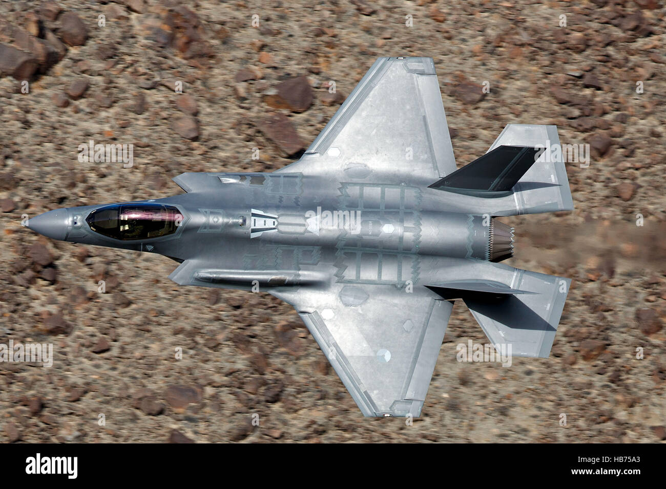 Lockheed Martin F-35A Lighting II from the 323 Squadron, Royal Netherlands Air Force, flies low level through the Jedi Transition, Star Wars Canyon, Death Valley National Park, California, United States of America Stock Photo