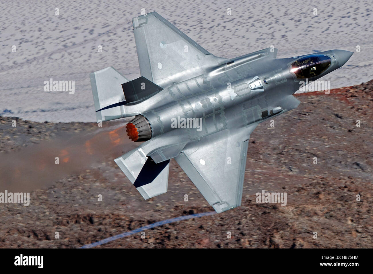 Lockheed Martin F-35A Lighting II from the 323 Squadron, Royal Netherlands Air Force, flies low level through the Jedi Transition, Star Wars Canyon, Death Valley National Park, California, United States of America Stock Photo