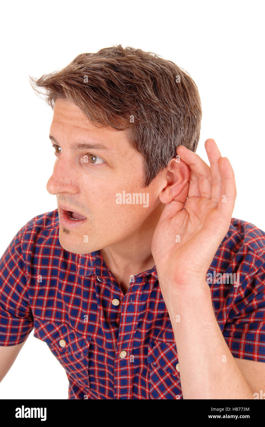 Jung man is hard of hearing. Stock Photo