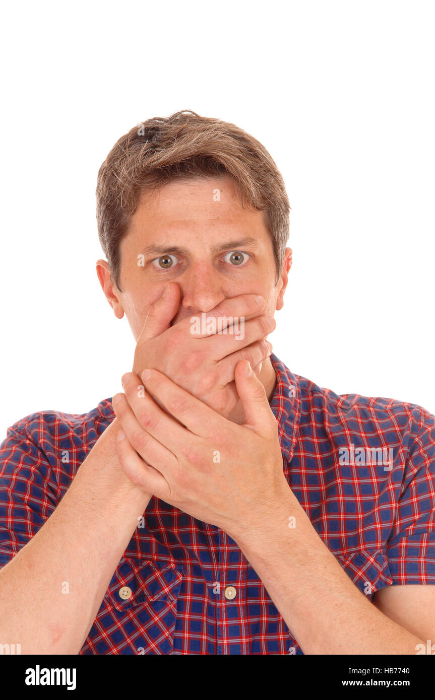 Man holding hands over mouths. Stock Photo