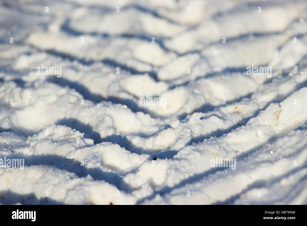 traces of the tractor on the white snow Stock Photo - Alamy