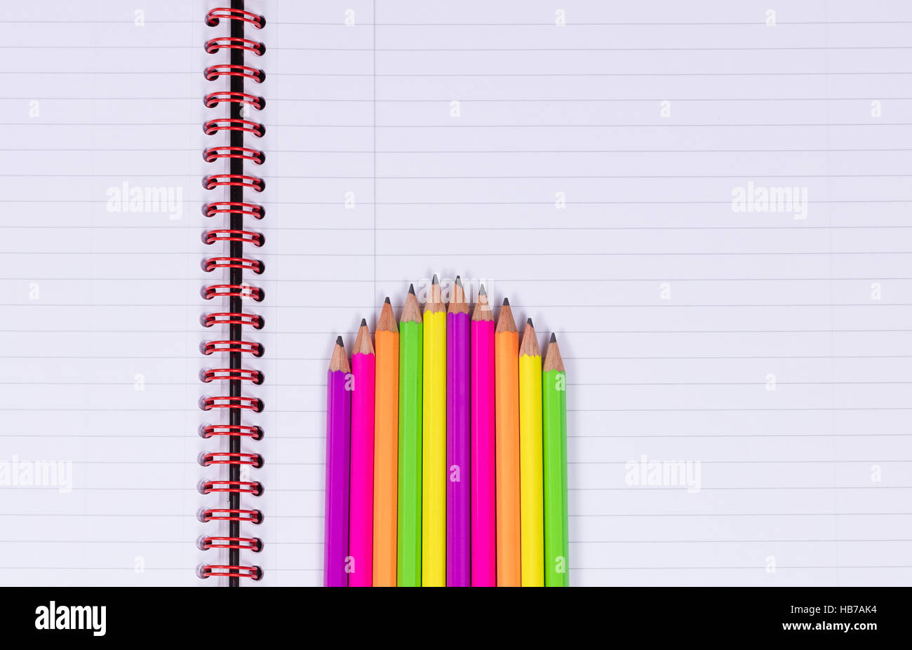 Pencil tips on a spiral notebook background Stock Photo