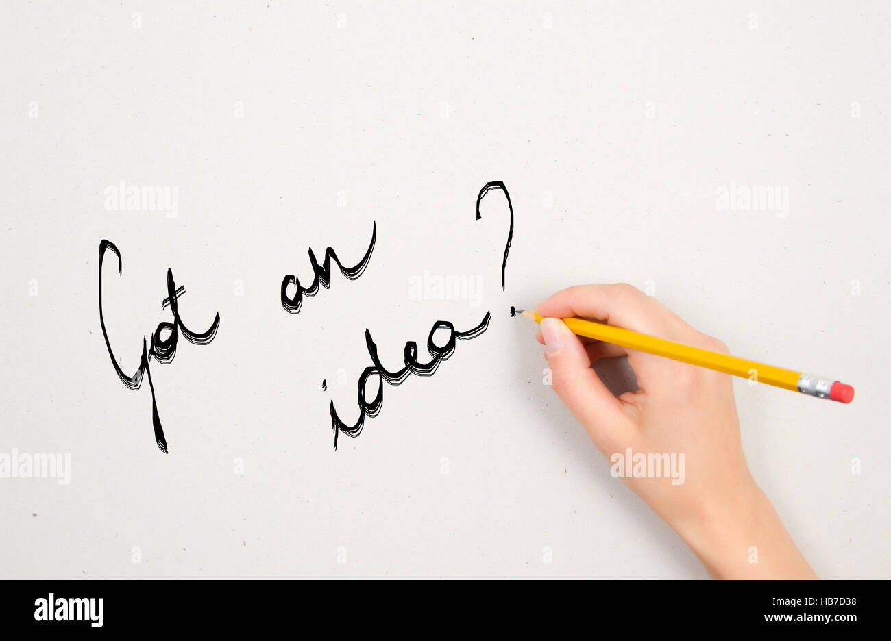 a woman's hand is writing a question with a pencil on a white sheet of ...