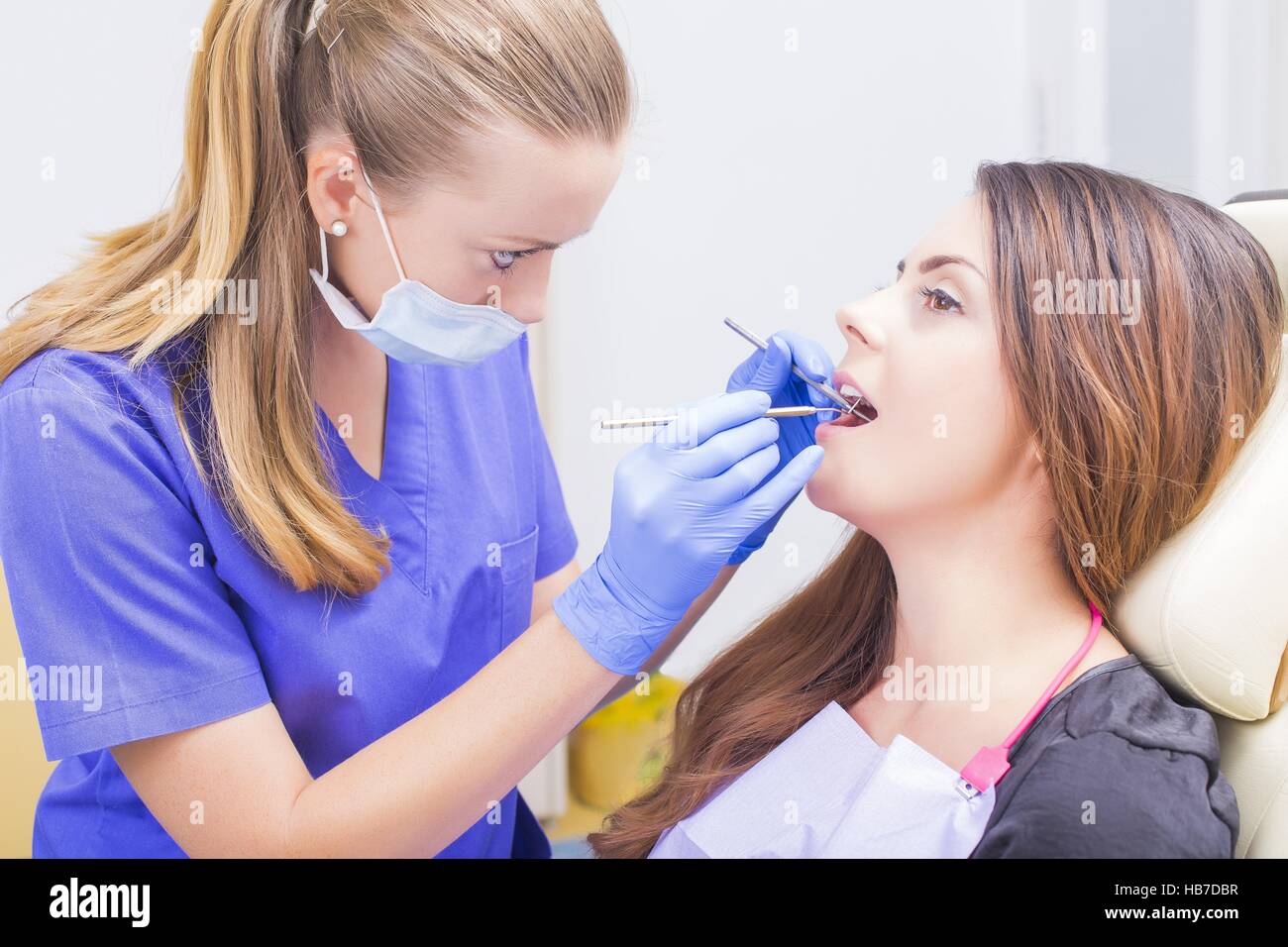 Dentist filling patients cavities with spacial dental tools Stock Photo Alamy