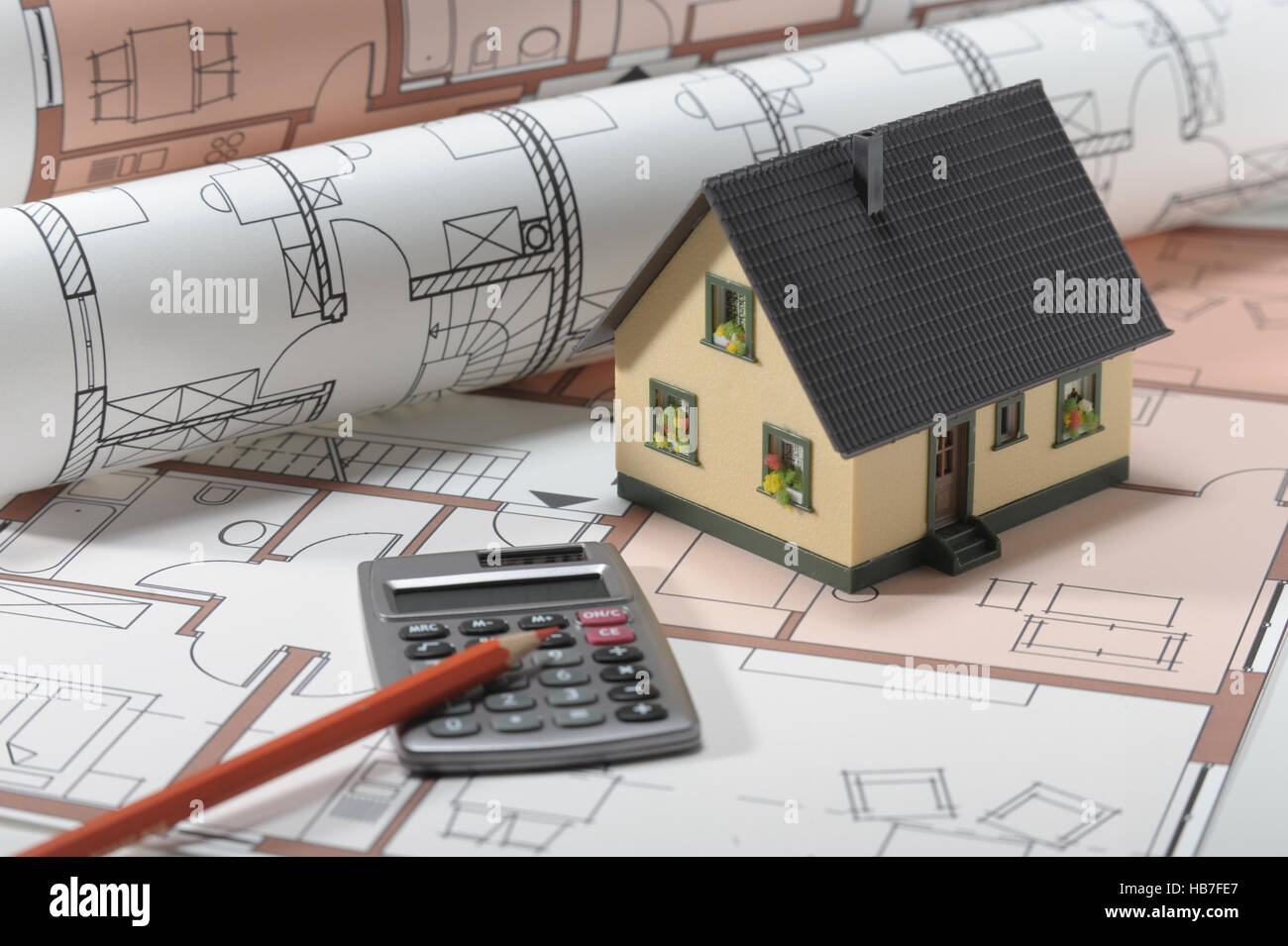 house building with plan and calculator Stock Photo