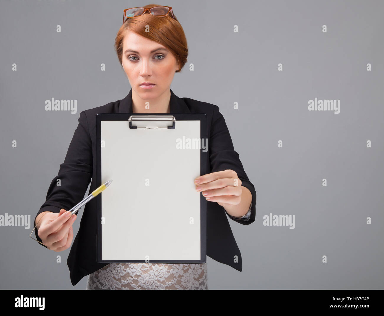 young red-haired secretary with a blank folder Stock Photo - Alamy
