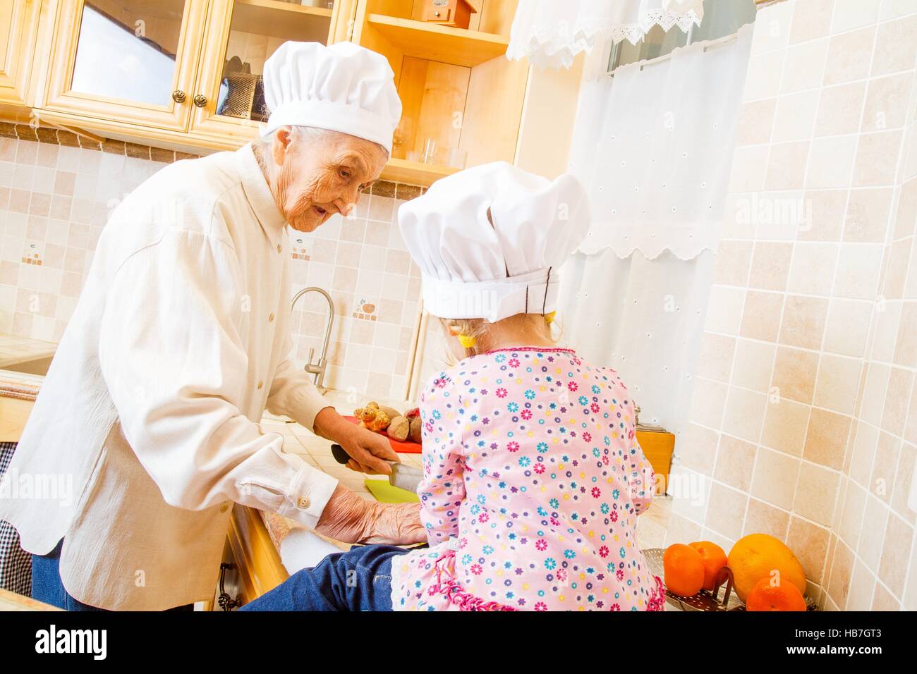Cooking granny mother girl hi-res stock photography and images - Alamy