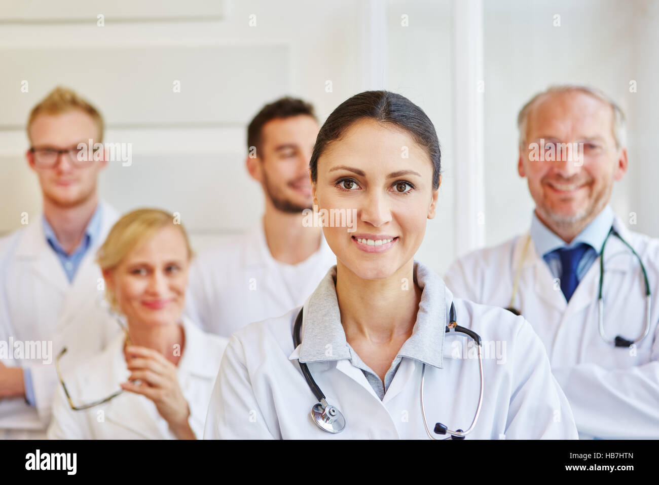 Woman doctor with team in hospital Stock Photo - Alamy