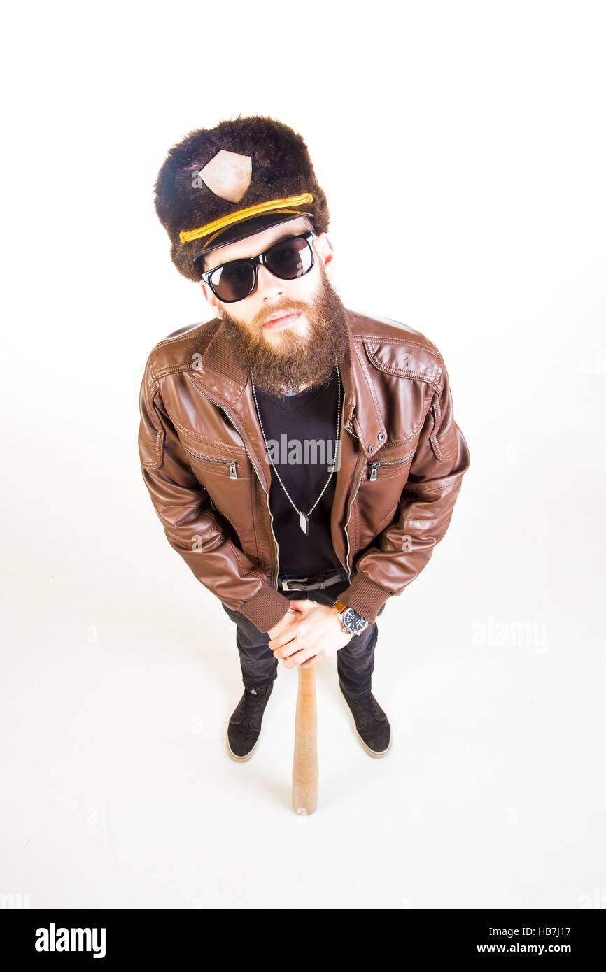 Weird cop with sunglasses holding a baseball bat on white background