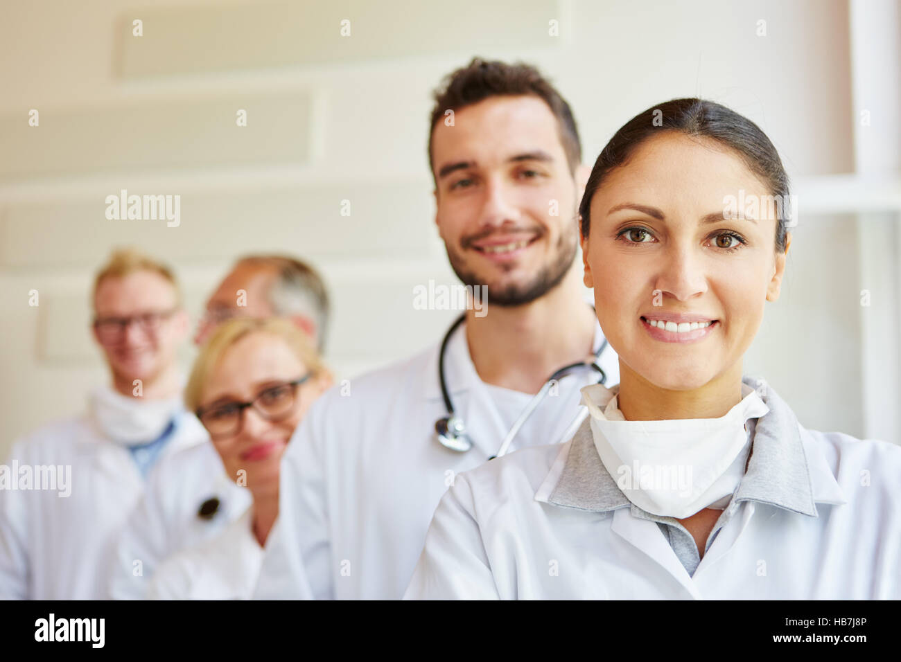 Friendly doctors as team in hospital and MTA Stock Photo