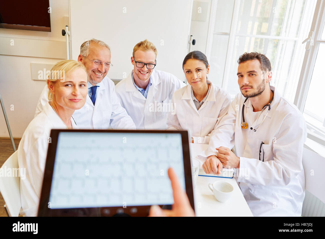 Doctors in ECG training learning about diagnose analysis Stock Photo