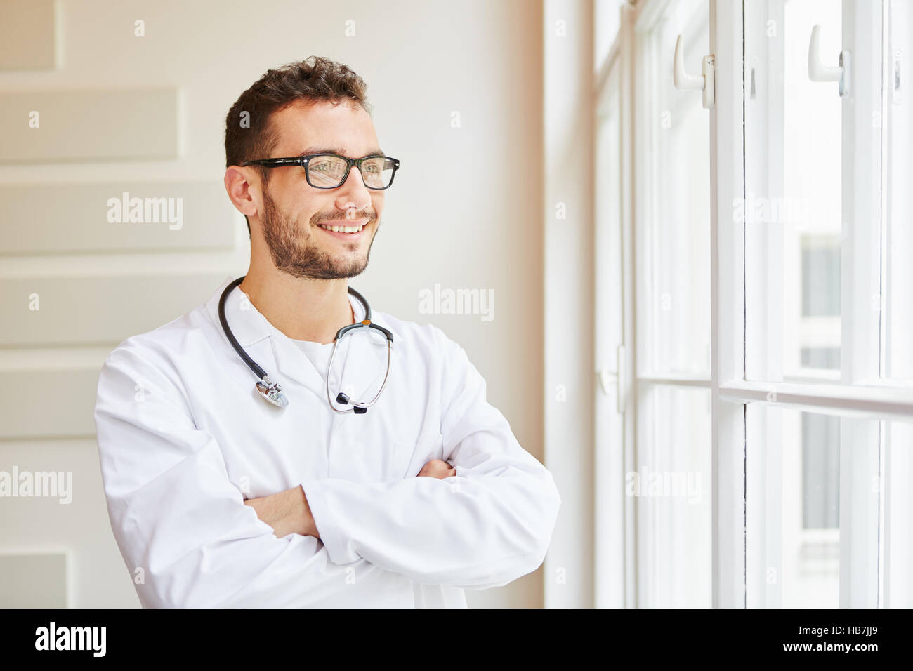 Competent doctor proud of his profession looking self-confident Stock Photo