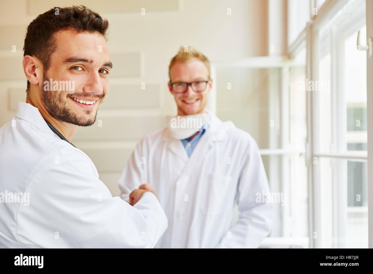 Doctors congratulate each other of successful teamwork Stock Photo