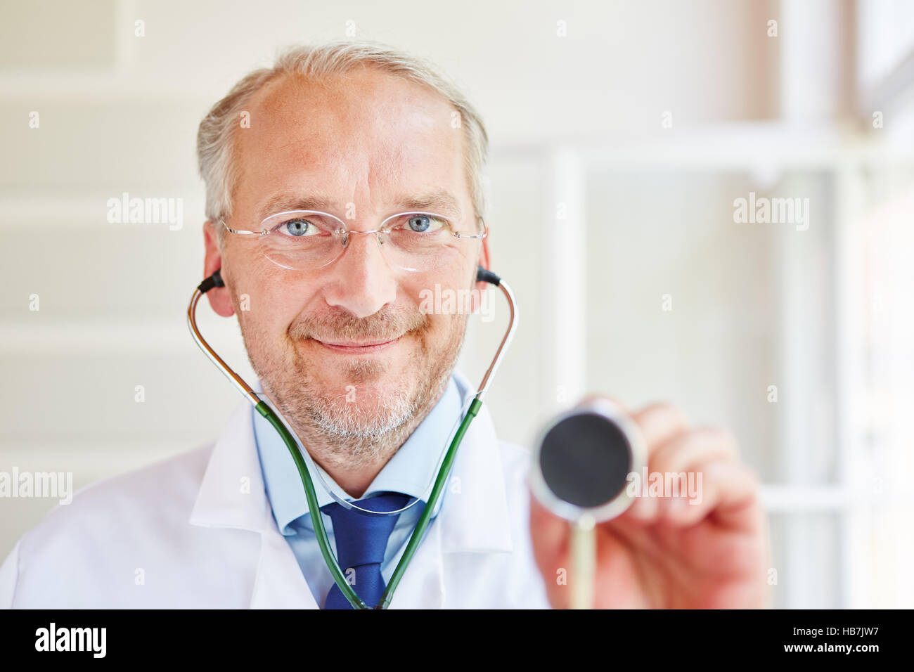 Doctor with stethoscope for diagnose and examination Stock Photo