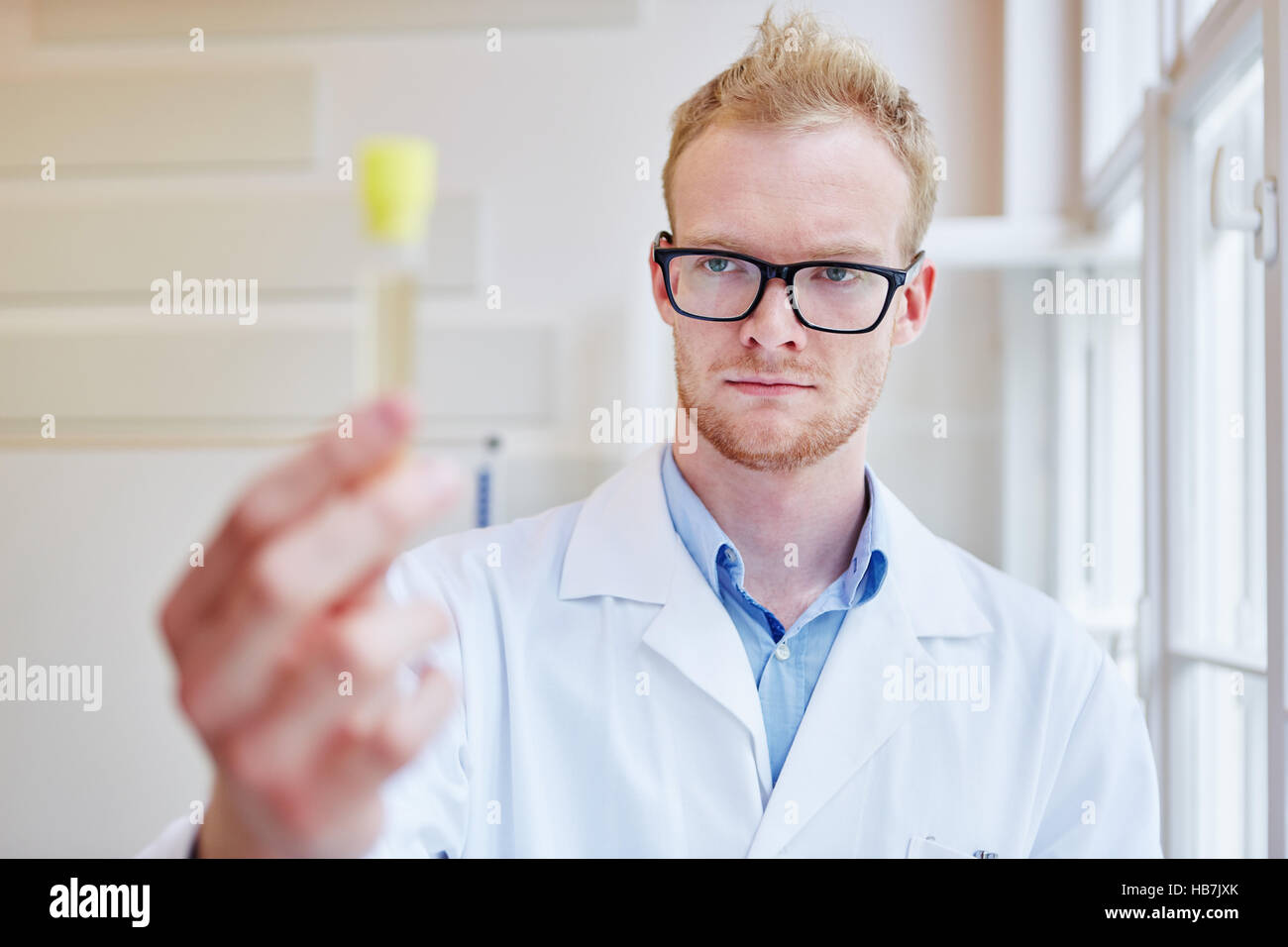 Doctor makes alcohol test with urine sample and analysis Stock Photo