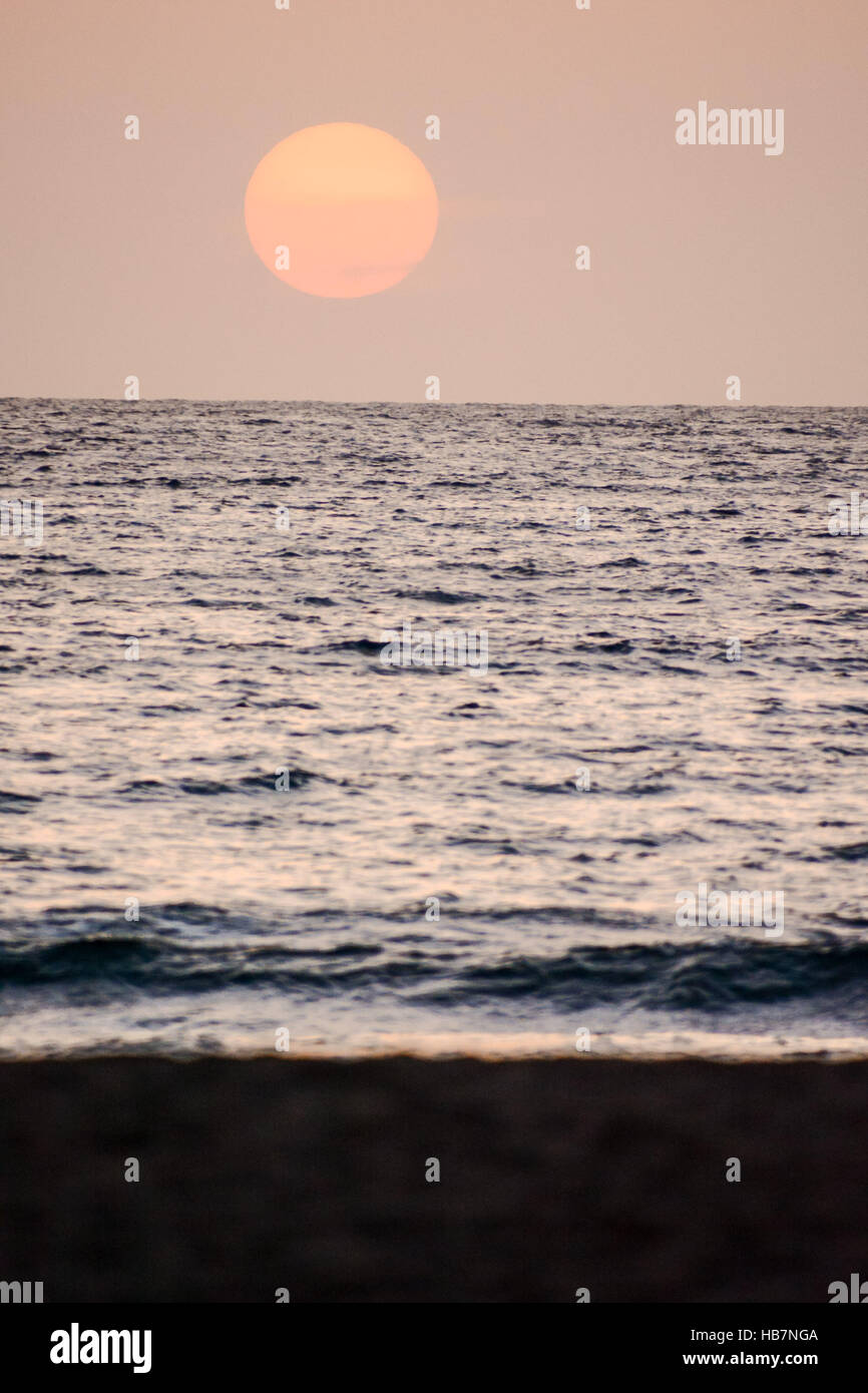 Sea Setting Example The Sun Setting in the Sea Stock Photo - Alamy
