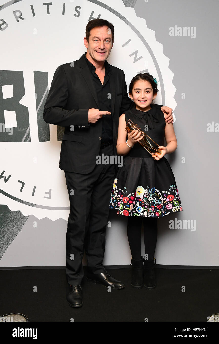 Avin Manshadi with the Best Supporting Actress Award for Under the Shadow, alongside presenter Jason Isaacs during the British Independent Film Awards, at Old Billingsgate Market, London. Stock Photo
