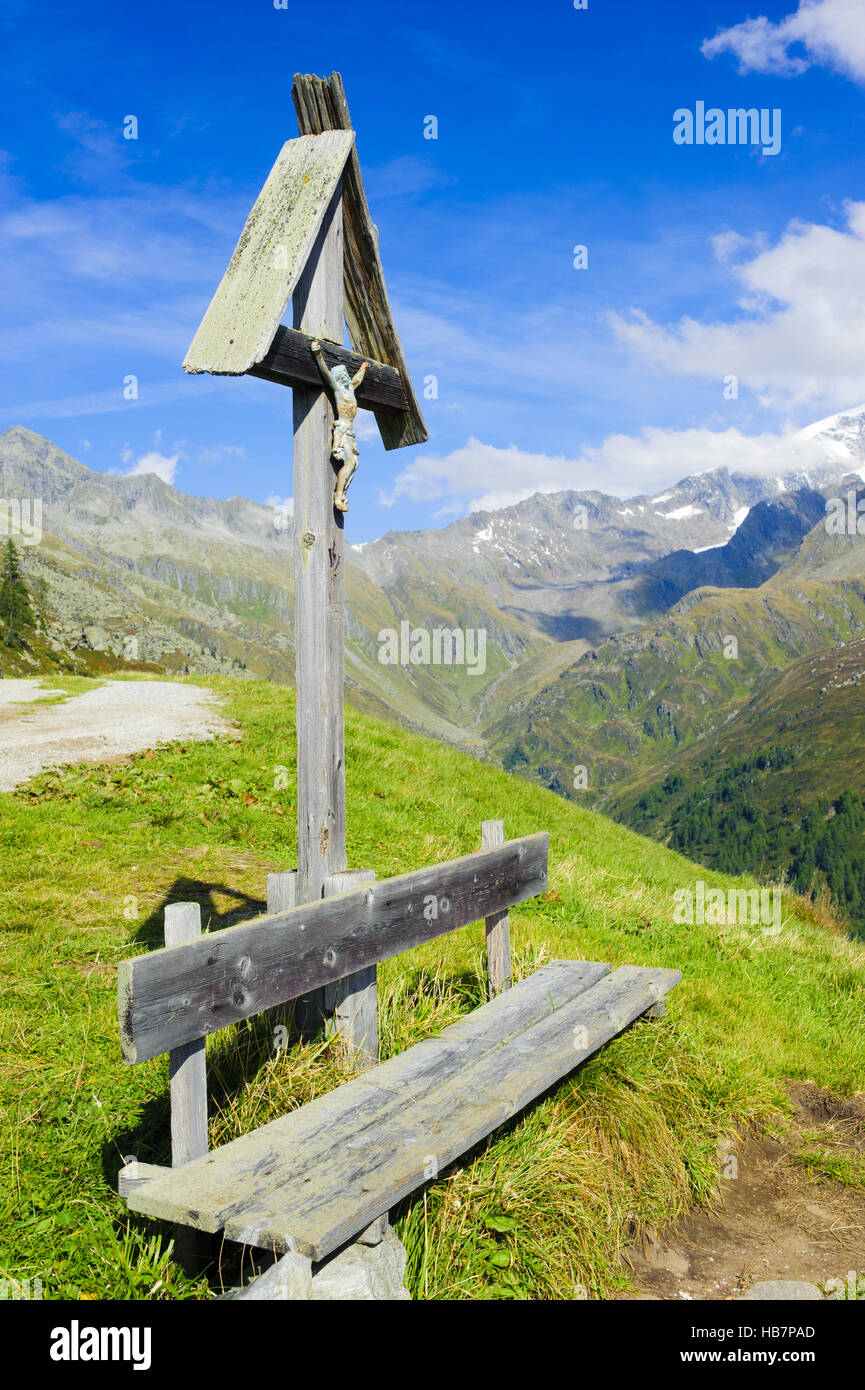 wooden bench in alps mountains Stock Photo Alamy