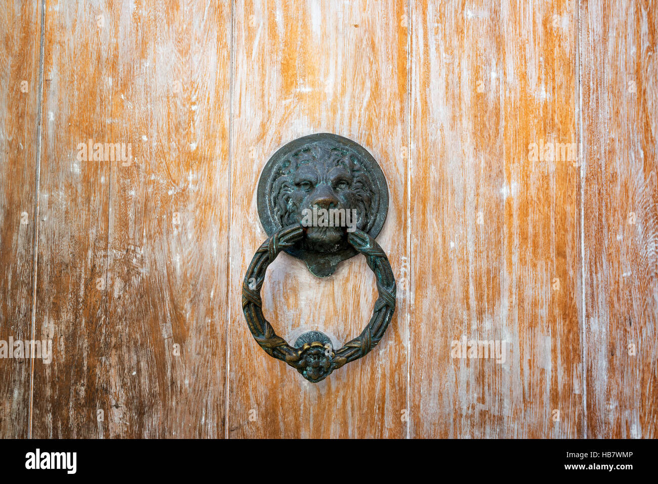 Lion head door knock on an old wooden door in Cartagena, Colombia Stock Photo