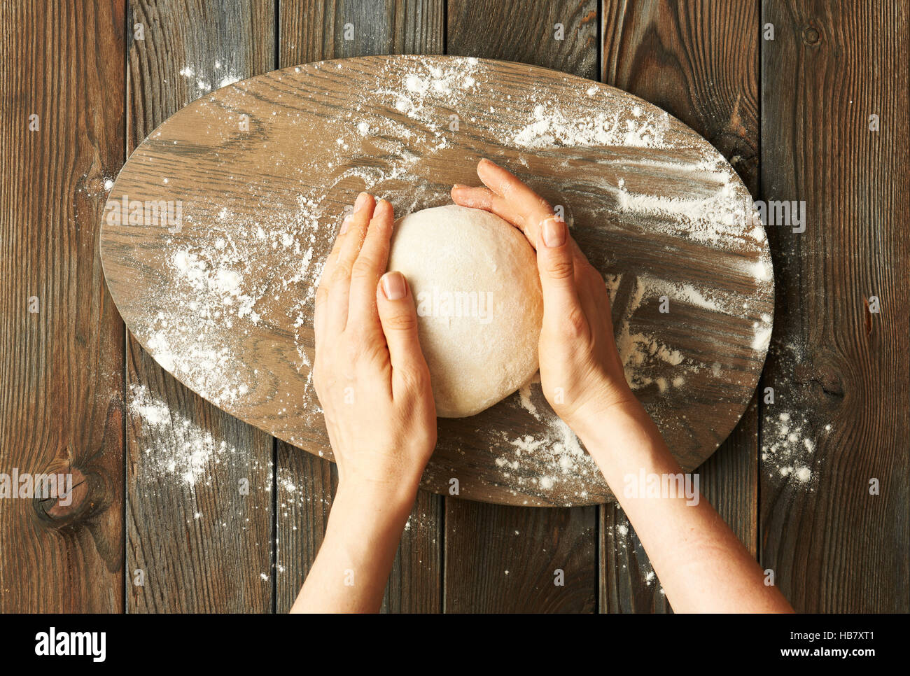 Female hands kneading dough Stock Photo - Alamy