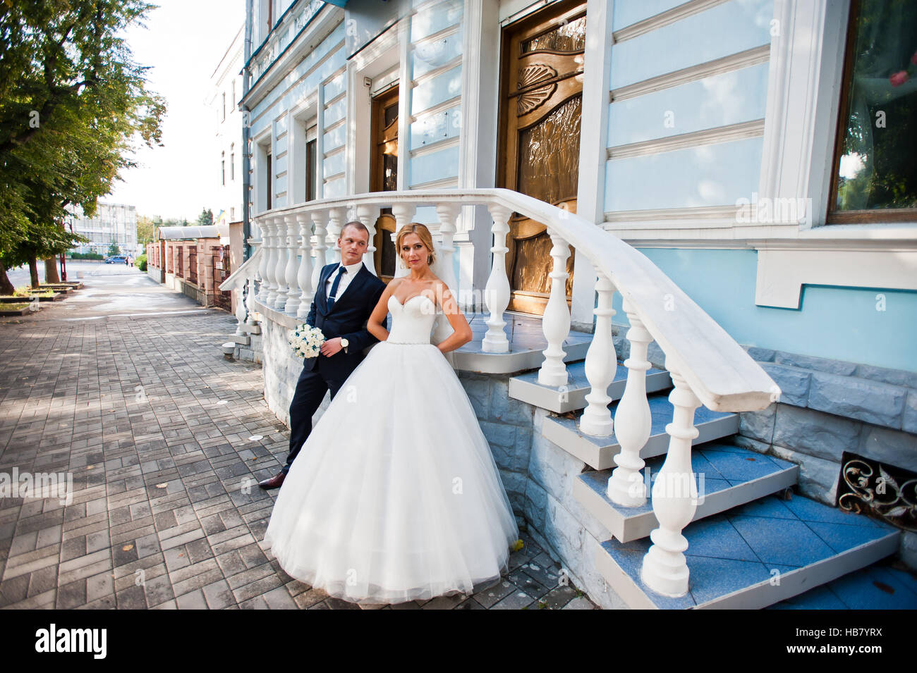 Wedding couple near white classic stairs Stock Photo
