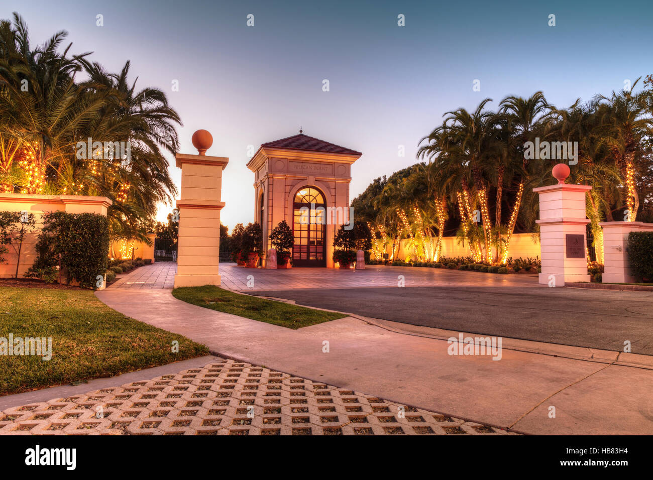 Holiday Christmas lights hung on trees in the entryway of Pelican Point