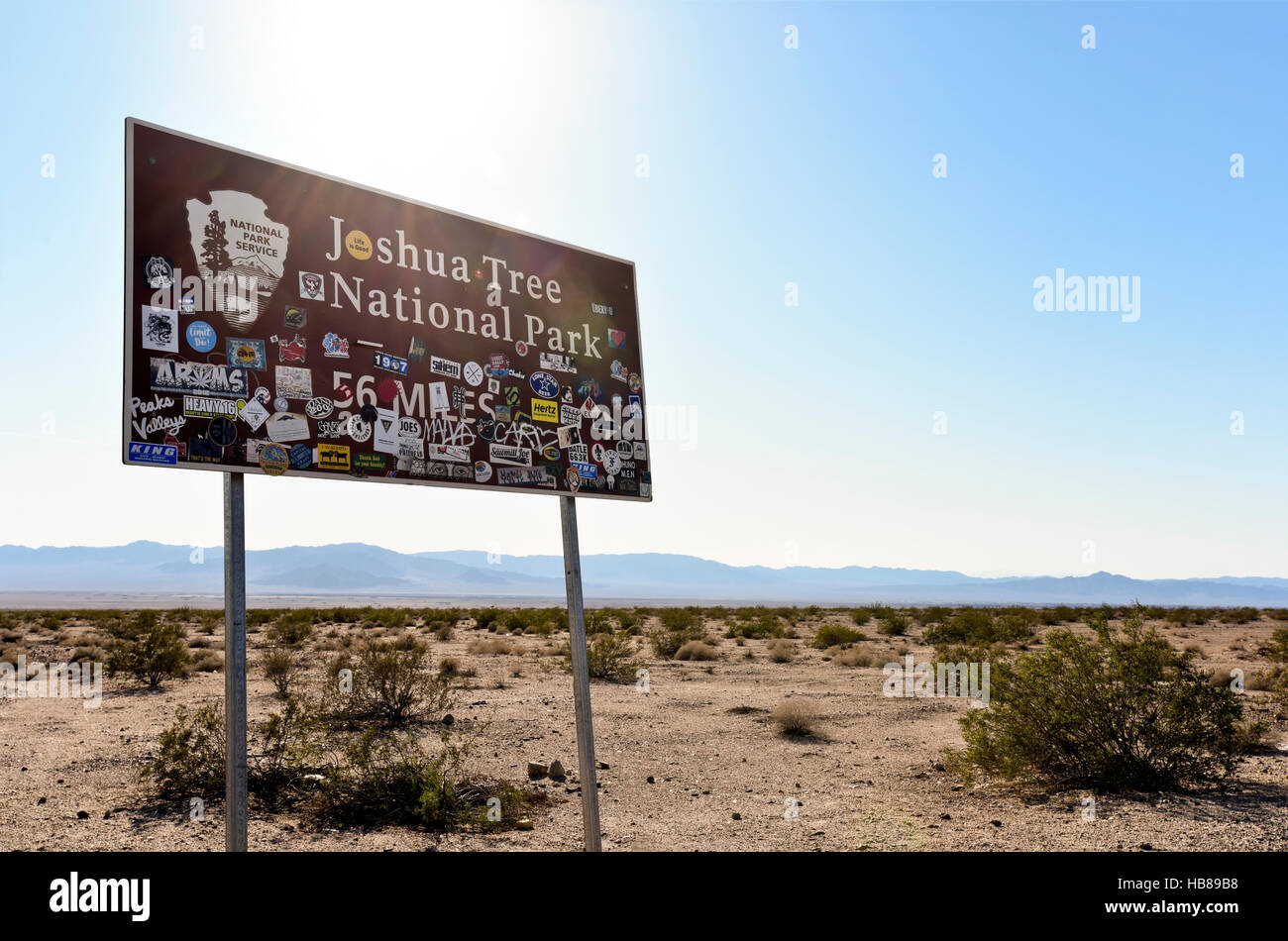 A National Park Service sign for Joshua Tree National Park, 56 miles ahead Stock Photo