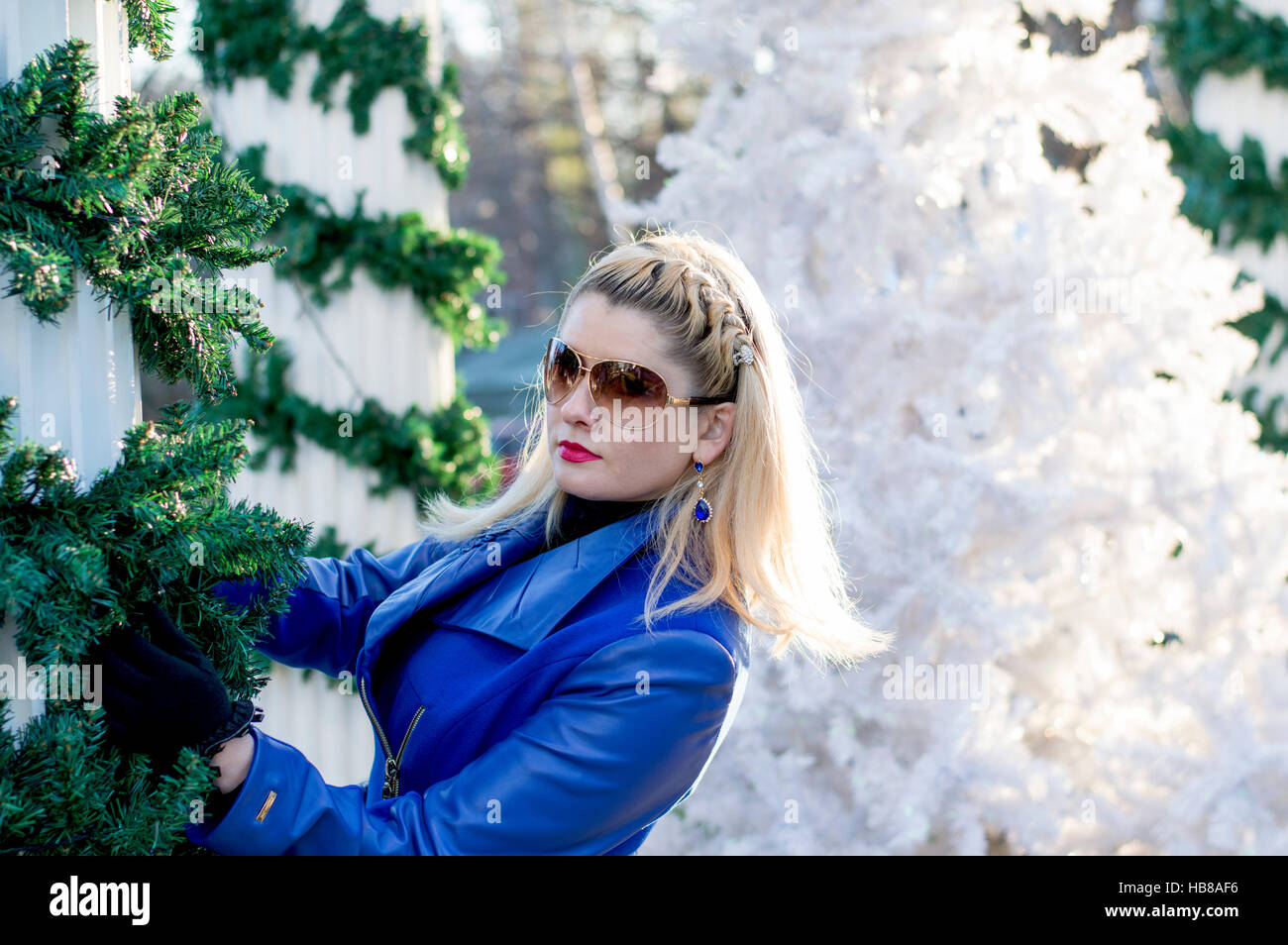 the blonde's portrait in a blue coat at New Year's scenery Stock Photo