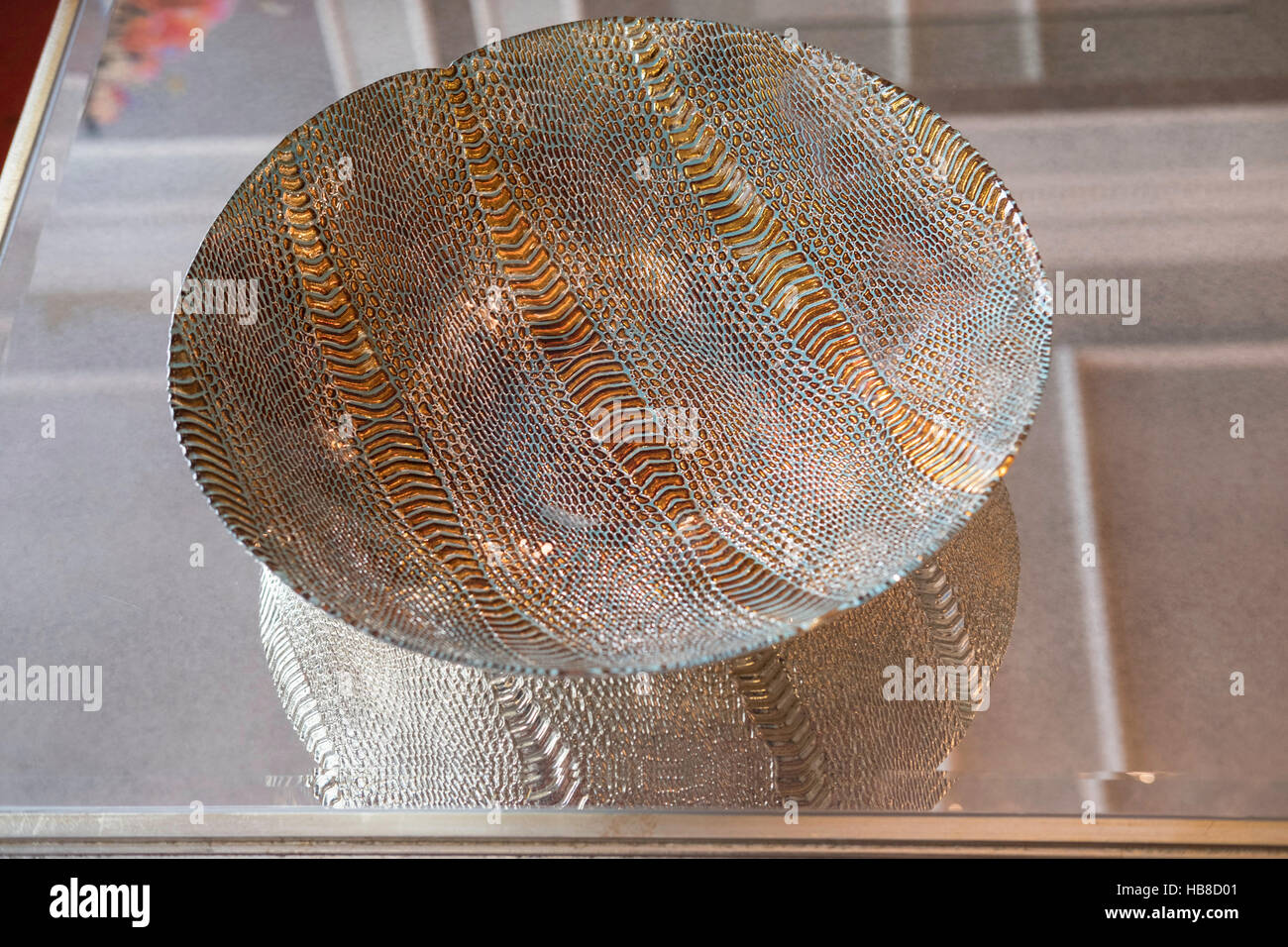 Glass and metal bowl on a glass table Stock Photo Alamy
