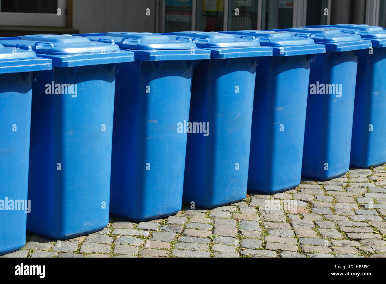 Blue tins, recycling bin for paper waste, Verden, Verden an der Aller, Lower Saxony, Germany Stock Photo