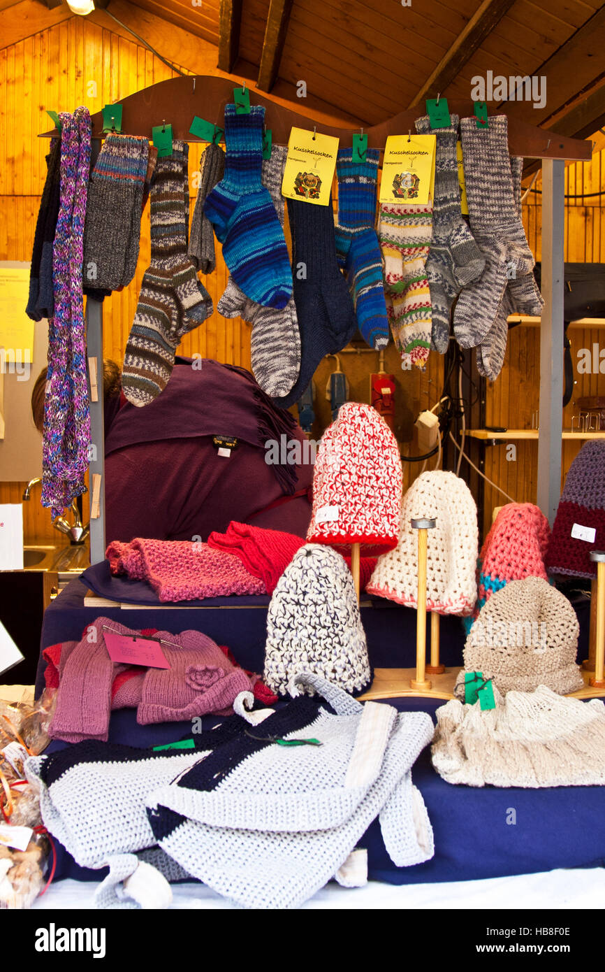 Christmas Fair Market at Ludwigsberg, Germany a booth with  hand knit wool socks, hats, scarves, and other woolen clothing, gift Stock Photo
