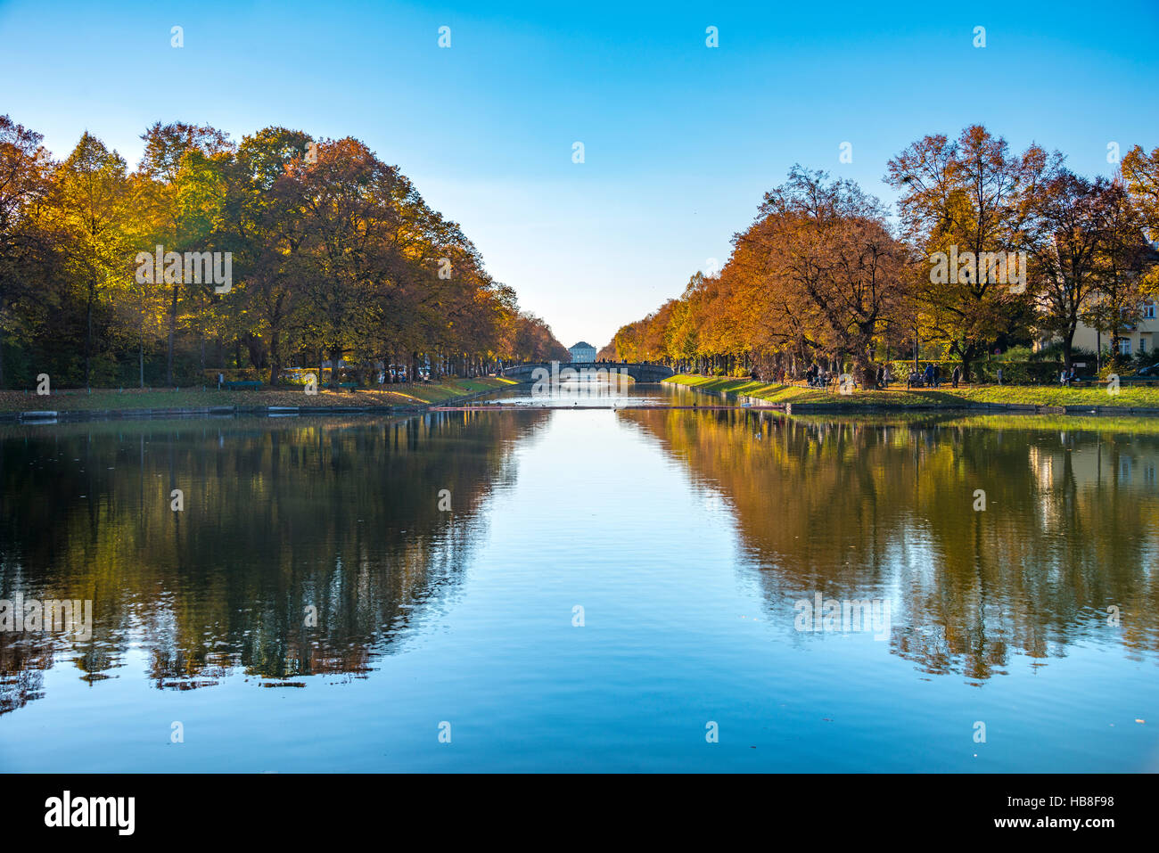 East side of Nymphenburg Palace with lock canal and bridge as seen from Hubertusbrunnen, autumn, Munich, Upper Bavaria, Bavaria Stock Photo