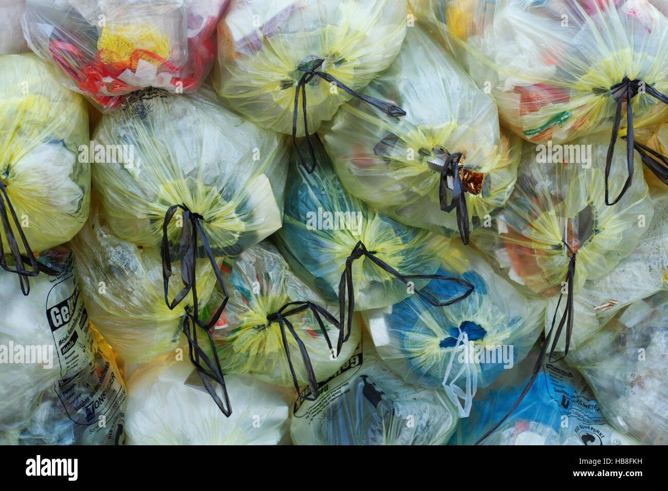 Stacked yellow bags with plastic waste, waste separation, Lower Saxony