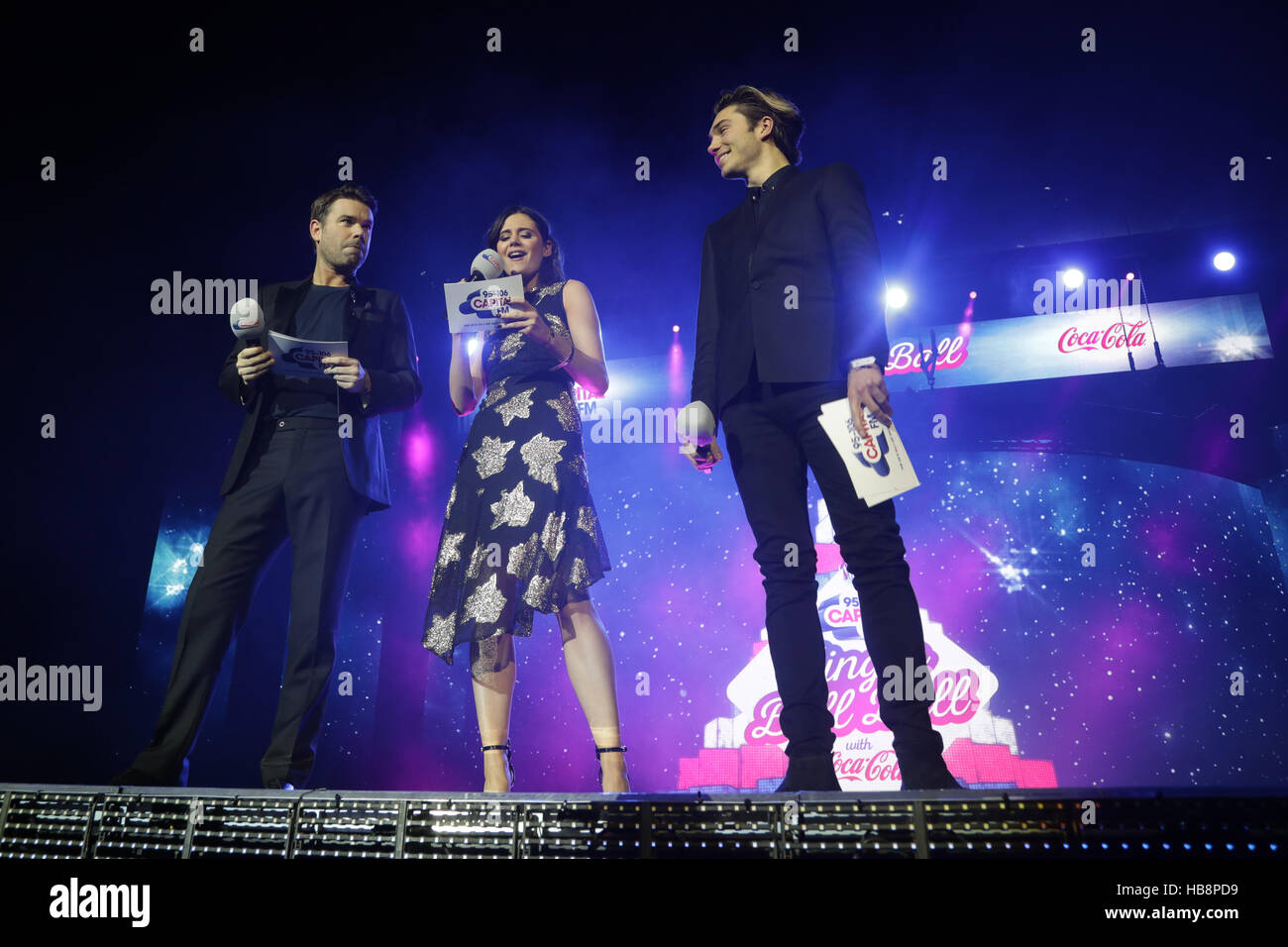 Capital presenters Dave Berry, Lilah Parsons and George Shelley on stage at Capital's Jingle Bell Ball with Coca-Cola at London's O2 arena. PRESS ASSOCIATION Photo. Picture date: Sunday 4th December 2016. Photo credit should read: Yui Mok/PA Wire Stock Photo