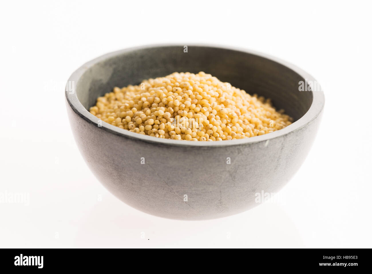millet groats on white Stock Photo Alamy