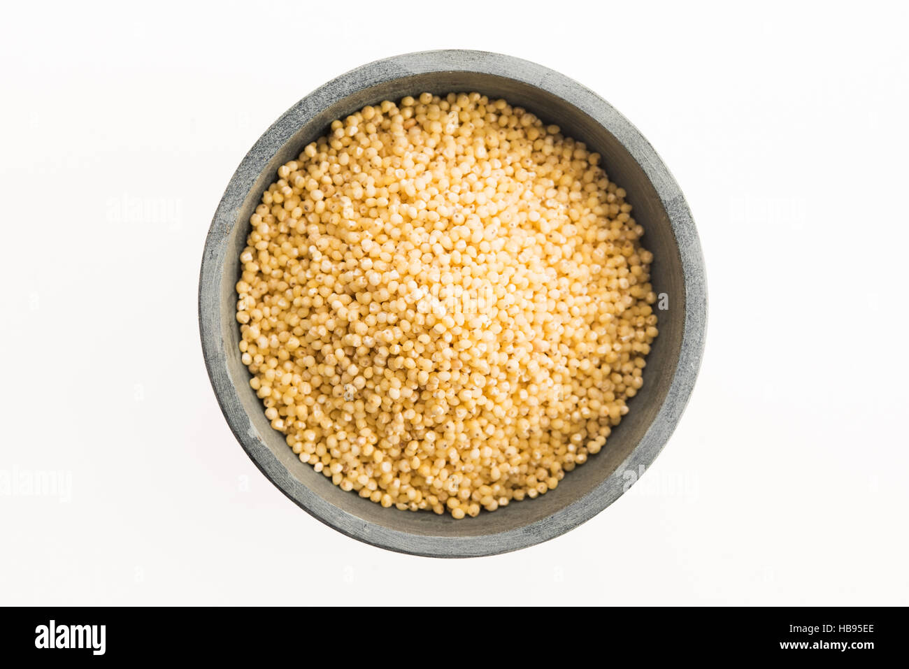 millet groats on white Stock Photo Alamy