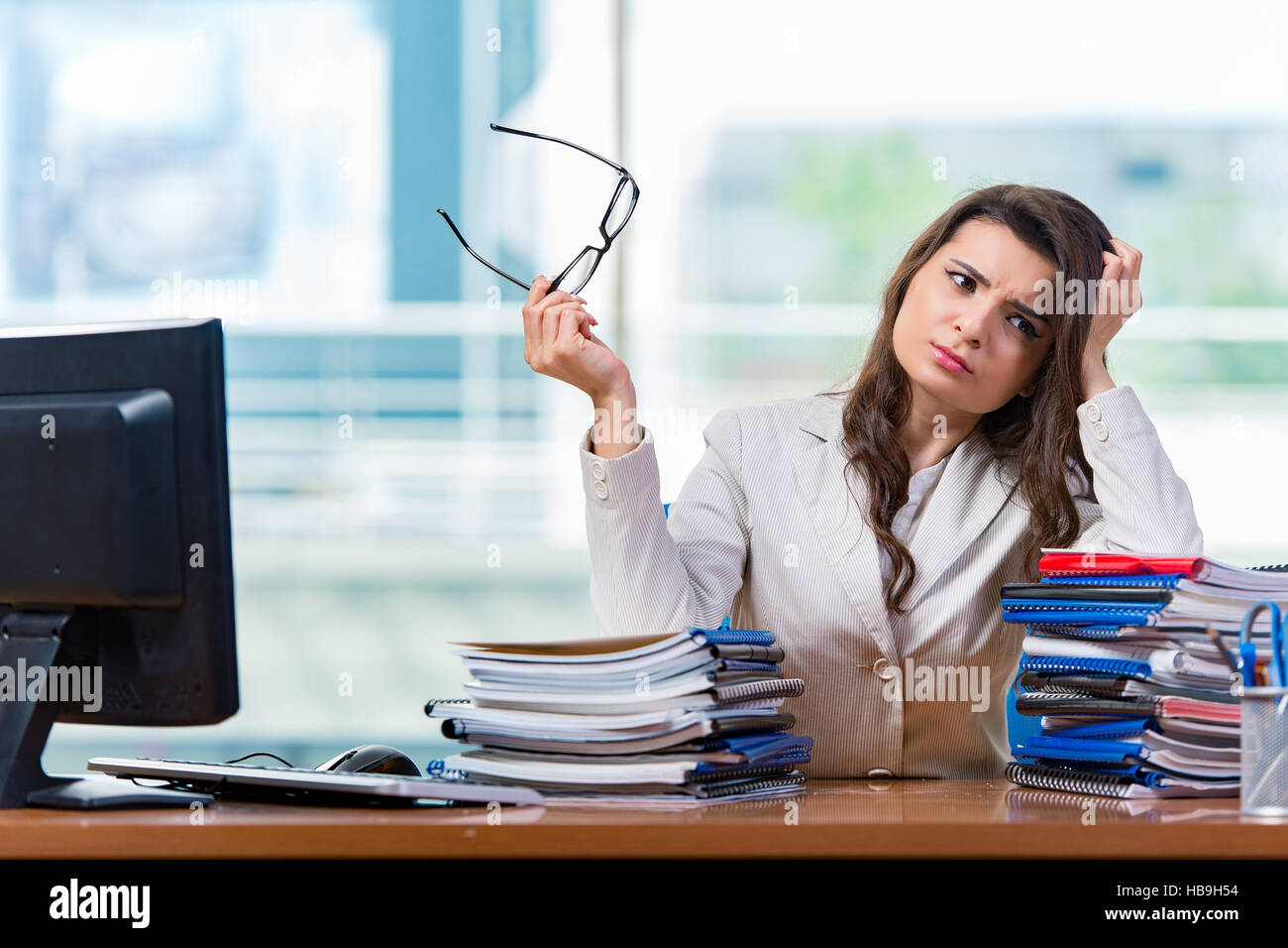 Businesswoman sitting at the office desk Stock Photo