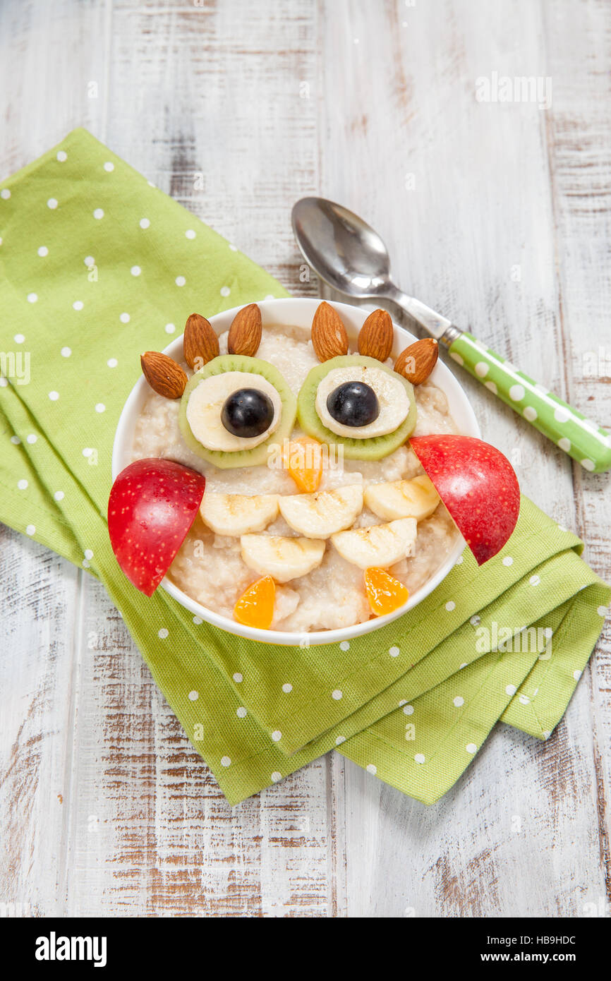 Kids breakfast porridge with fruits and nuts Stock Photo