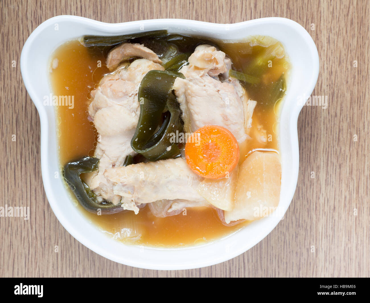 Japanese cuisine, chicken soup with daikon, carrot, and konbu Stock Photo