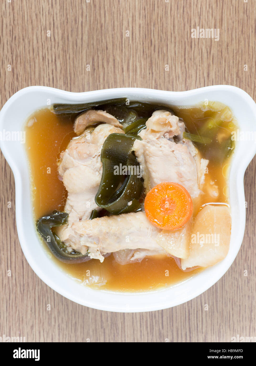 Japanese cuisine, chicken soup with daikon, carrot, and konbu Stock