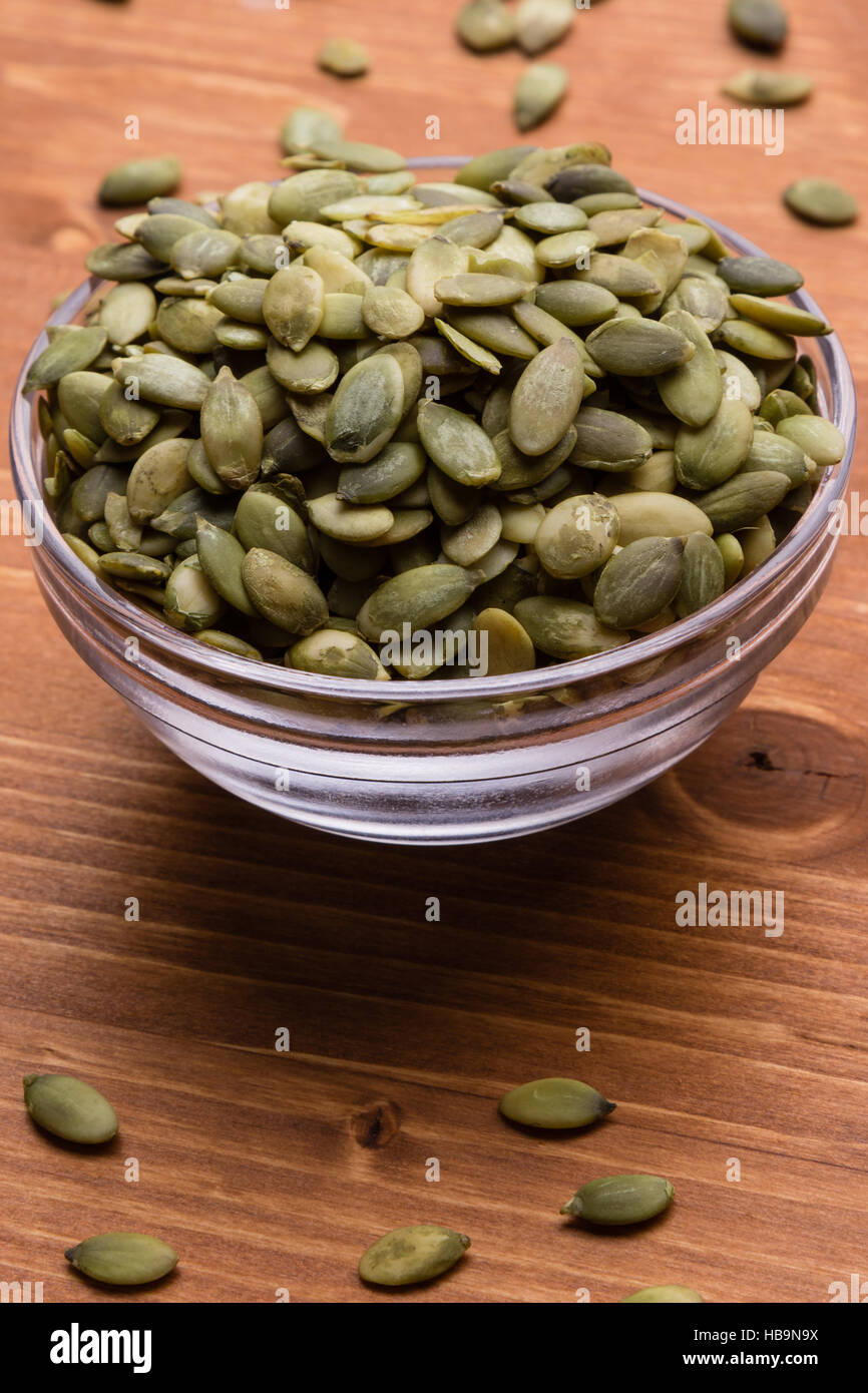pumpkin seeds in a glass bowl Stock Photo Alamy