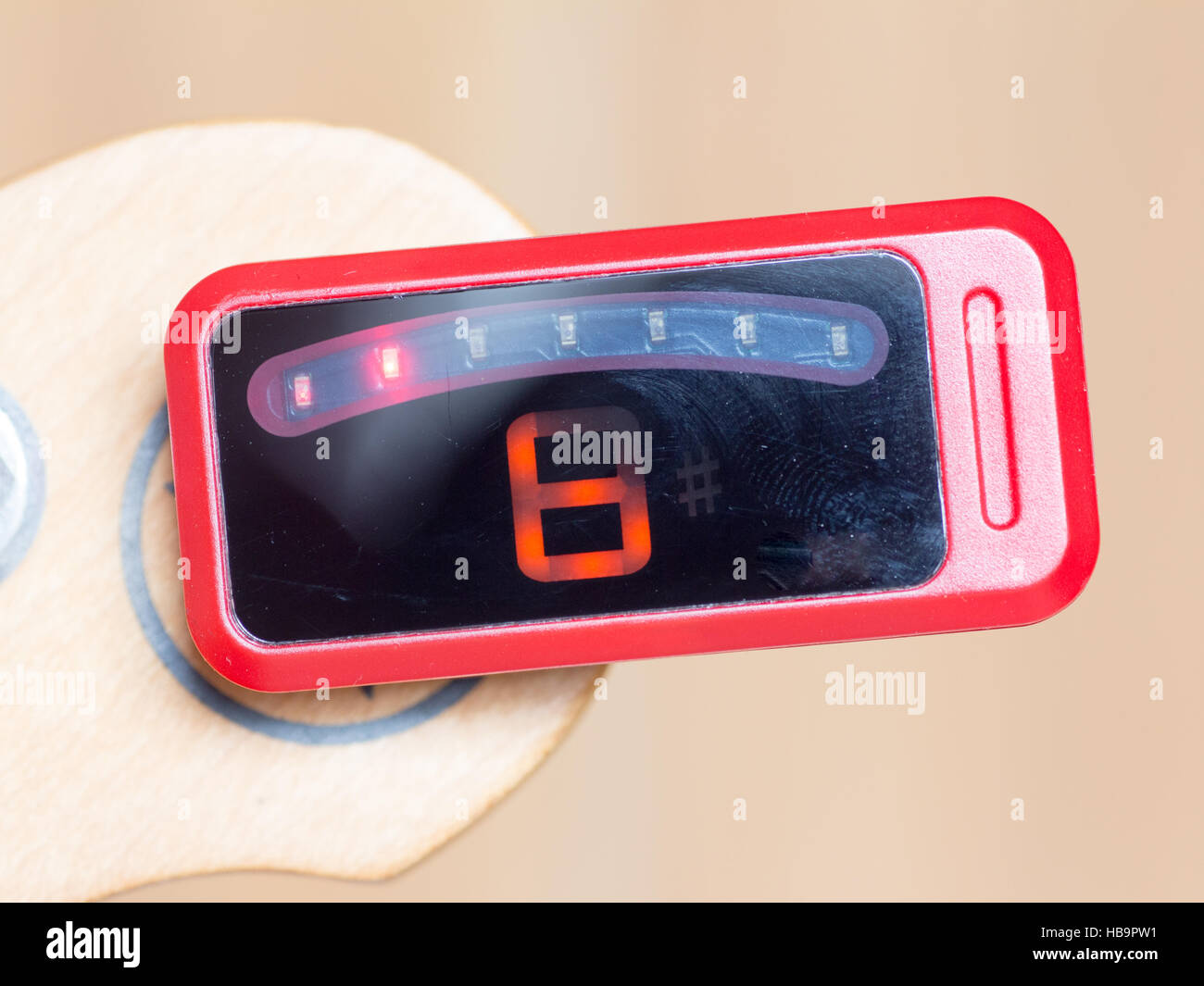 Series of tuning a guitar, B, out of tuning by a digital tuner Stock Photo Alamy