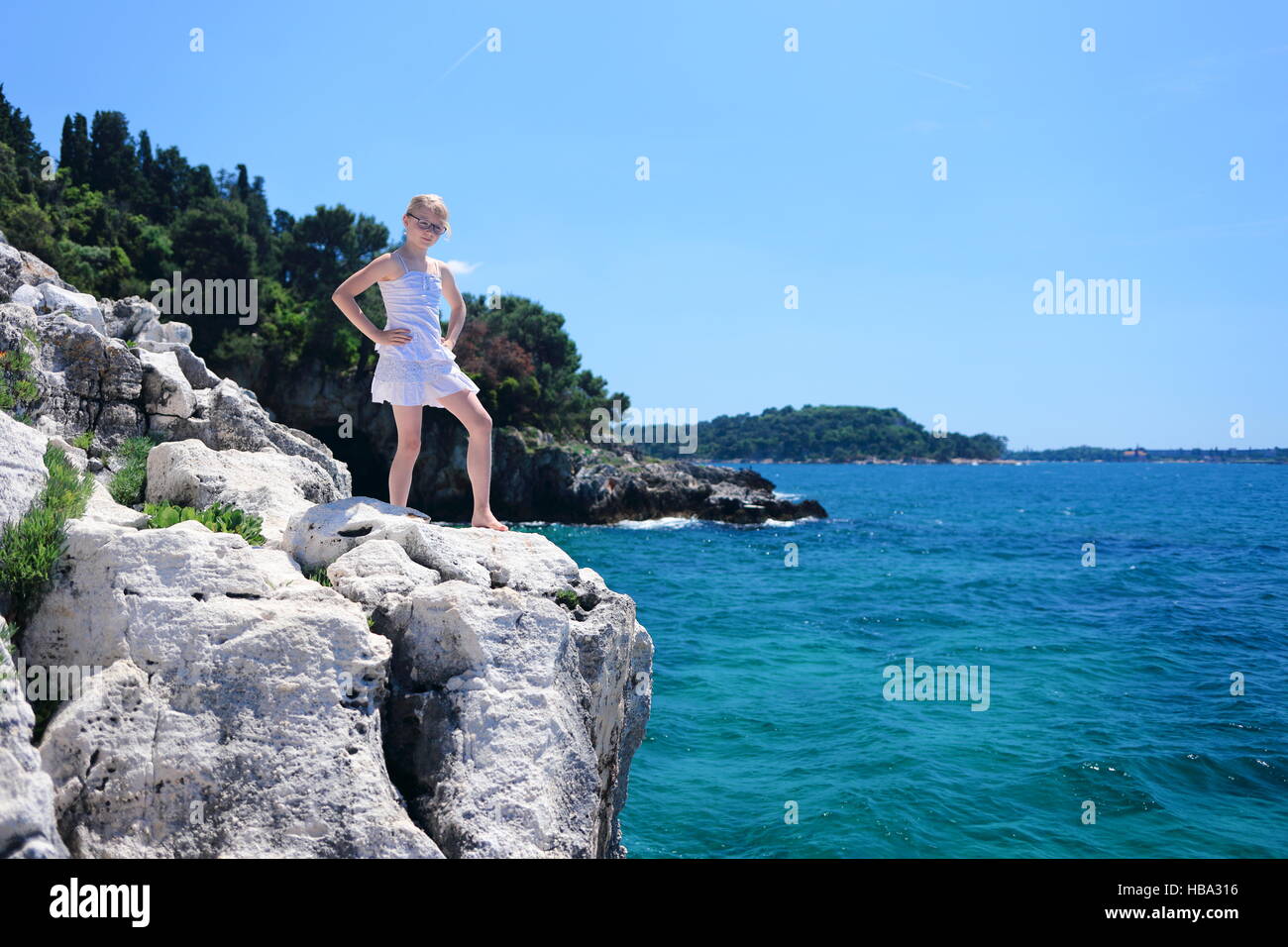 Girl standing on the cliff hi-res stock photography and images - Alamy