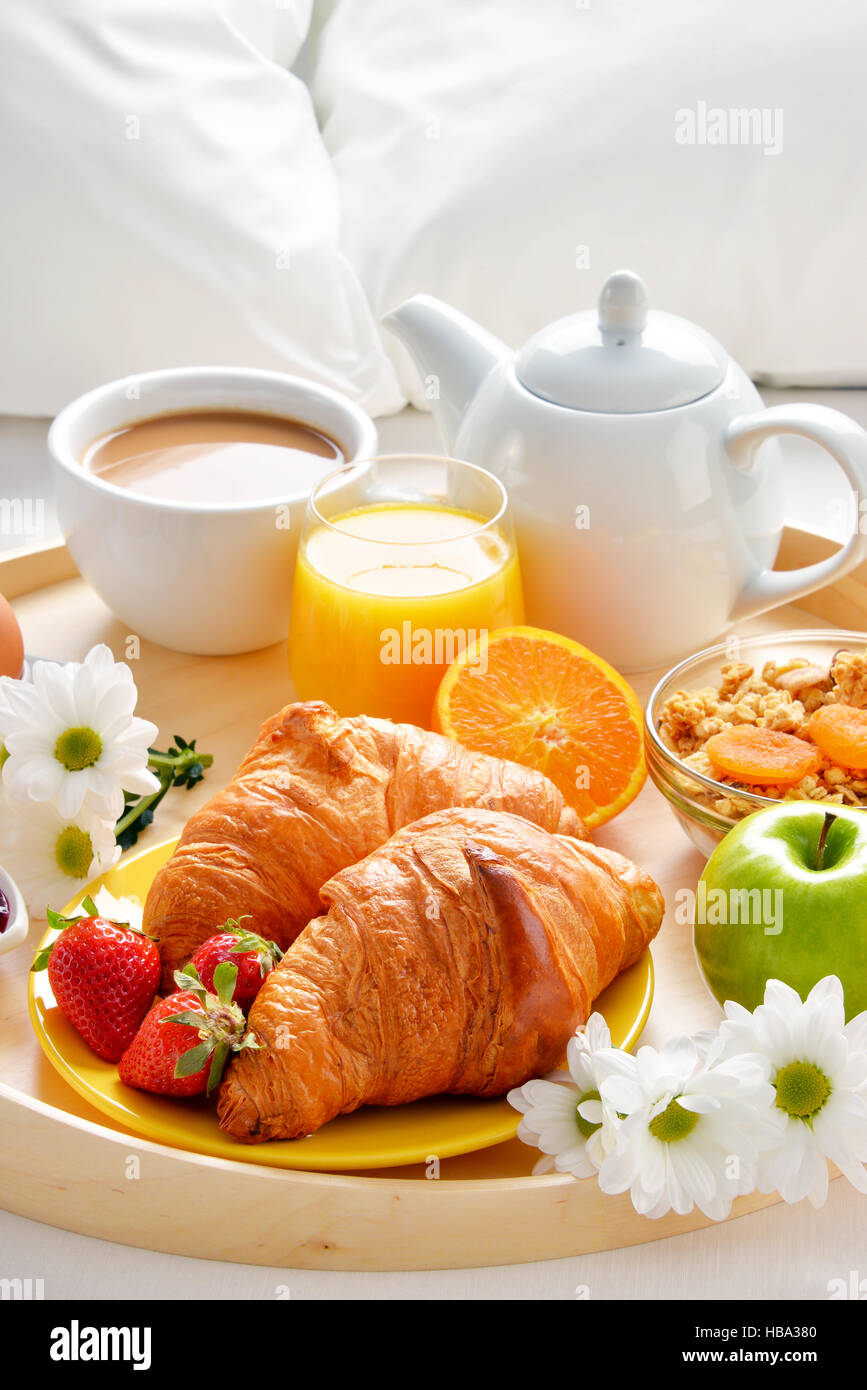 Breakfast tray in bed in hotel room Stock Photo Alamy